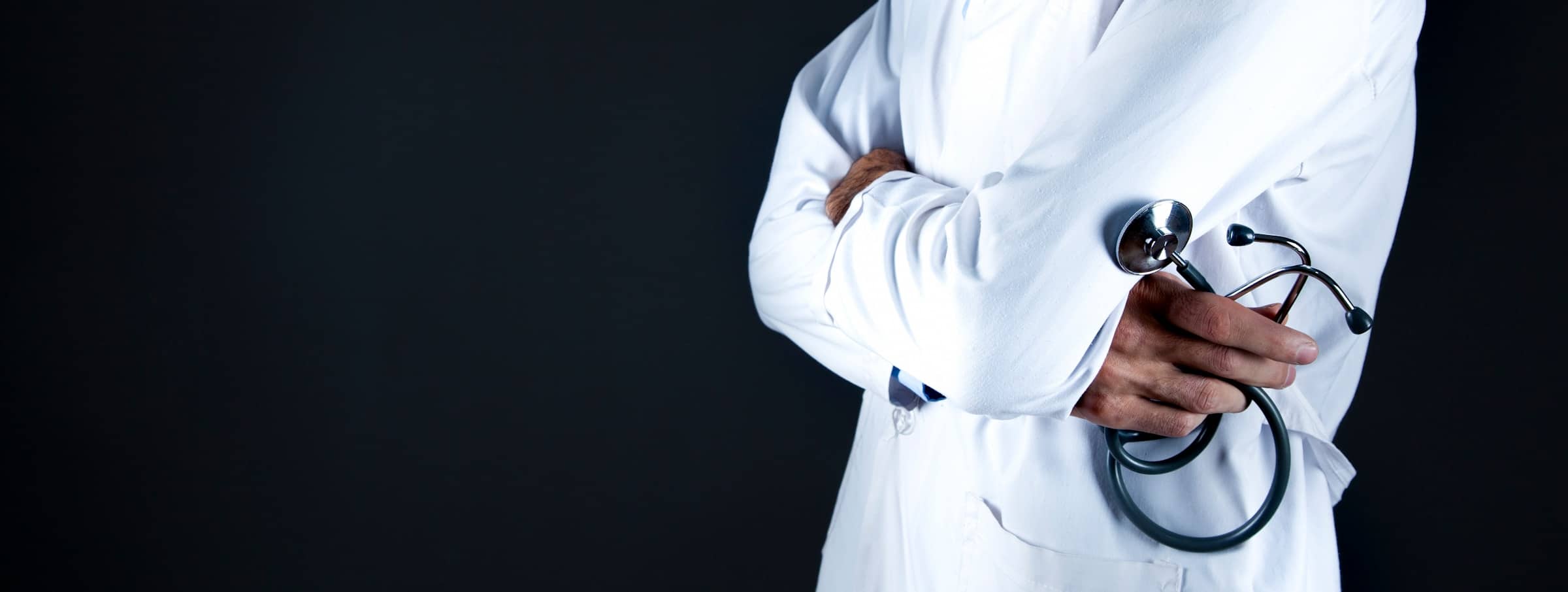 doctor standing with arms crossed